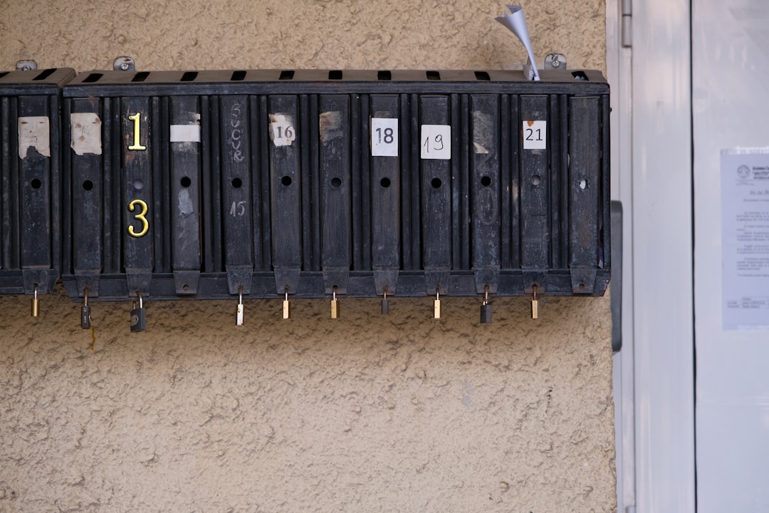 AC circuit breaker tripping homeowner inspecting electrical panel in garage - ac circuit breaker keeps tripping what it means